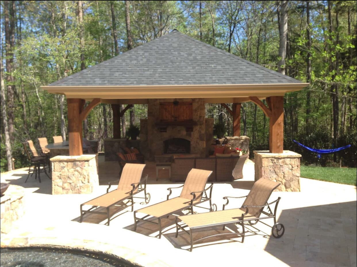 Cedar pavilion with stone fireplace, built by Vivid Outdoor Living in Mooresville